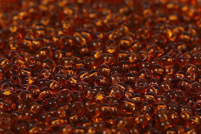 Preciosa Rocailles 11/0 Transparent Medium Topaz col.10090