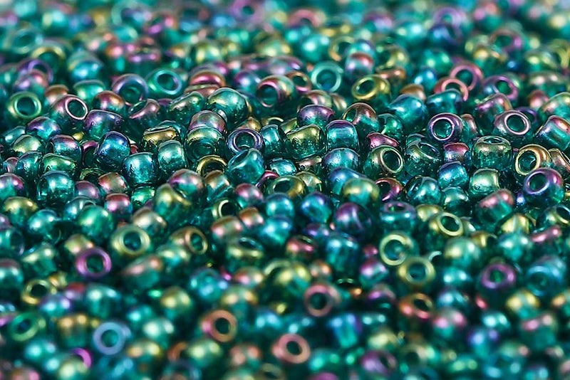 Preciosa Rocailles 11/0 Transparent Rainbow Teal Green col.51710