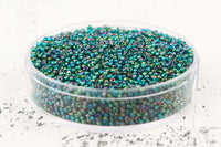 Preciosa Rocailles 11/0 Transparent Rainbow Teal Green col.51710