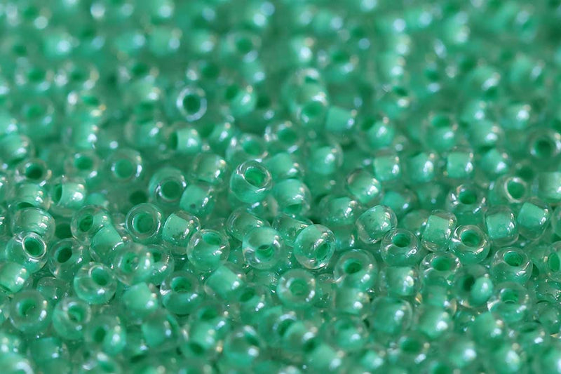 Preciosa Rocailles 10/0 Crystal Green Lined col.38656