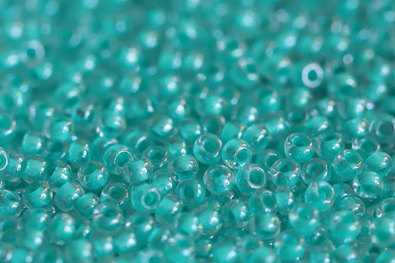 Preciosa Rocailles 10/0 Crystal Dark Green Lined col.38658