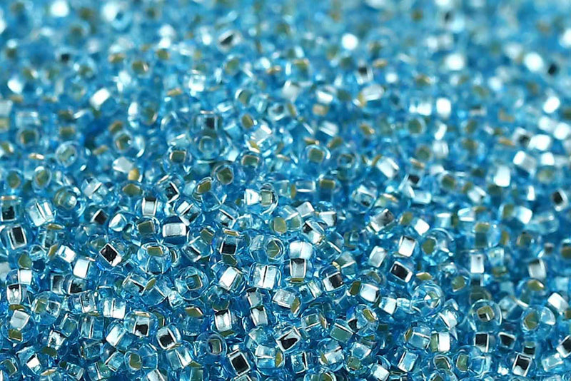 Preciosa Rocailles 11/0 Transparent Aqua Silver Lined col.67000