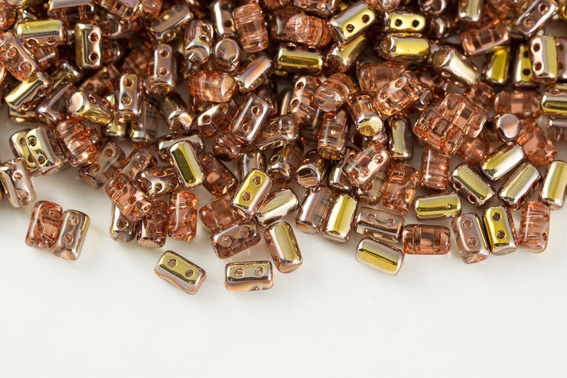Rulla 5×3mm Rosaline Capri Gold 2-Hole Czech Beads