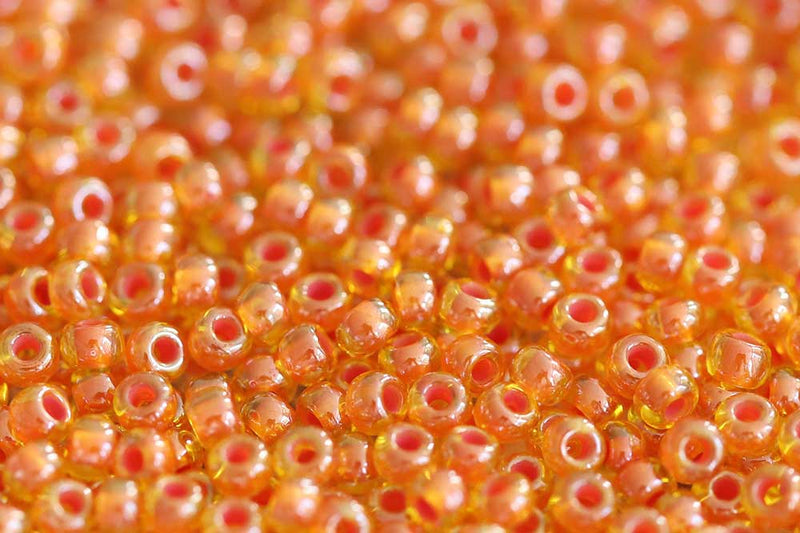 Preciosa Rocailles 10/0 Transparent Orange Lined col.81393