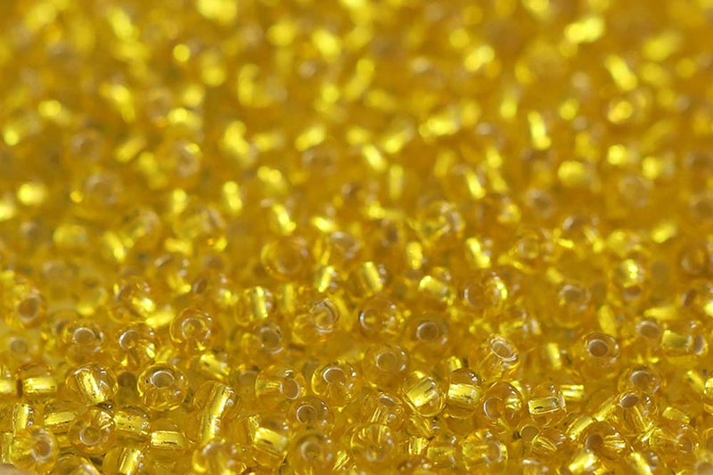 Preciosa Rocailles 10/0 Transparent Yellow Silver Lined col.87010