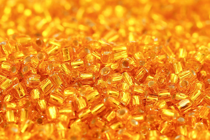 Preciosa 3-Cut 12/0 Transparent Amber Luster col.87060