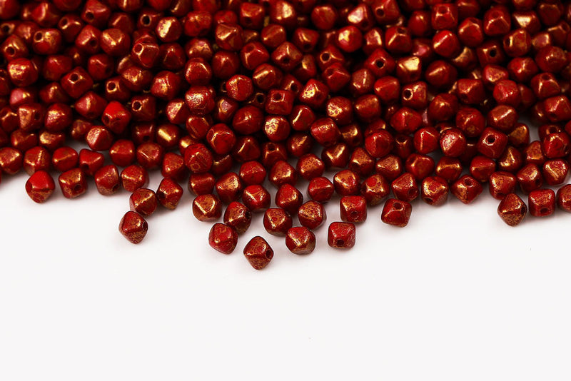 Bicone 4×4mm Opaque Coral Red With Gold Marble Finish 1-hole Czech Beads