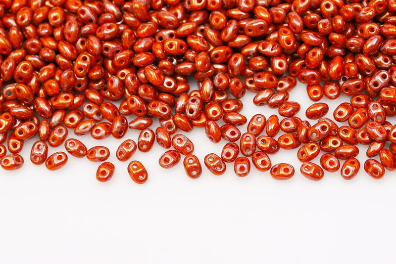 Miniduo 2×4mm Opaque Orange Nebula 2-Hole Czech Beads